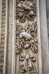 Fototapeta na wymiar Details of the external bas-reliefs of Milan Cathedral (Duomo di Milano). Milan, Italy