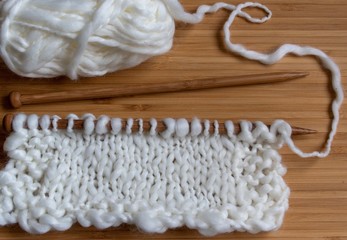 knitting on needles in neutral colours 