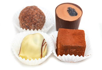 festive Christmas candy handmade on a white background. close up. chocolate temptation.