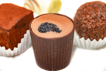 festive Christmas candy handmade on a white background. close up. chocolate temptation.