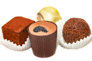 festive Christmas candy handmade on a white background. close up. chocolate temptation.