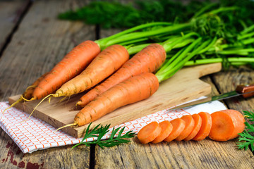 Fresh sweet carrots on a old wooden table