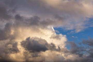 Fototapeta na wymiar Beautiful epic storm grey cumulus clouds against blue sky background texture