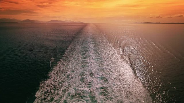 Cinemagraph of cruise ship wake in the Mediterranean sea at sunset, seamless loop