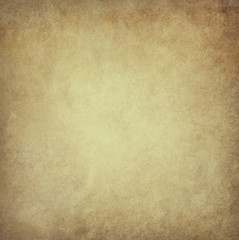 old brown parchment paper background with yellowed vintage grunge texture borders and light center with distressed faded antique colors