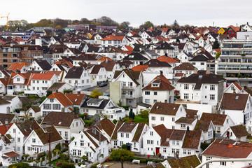 Fototapeta na wymiar Thousands of white houses with red rooftops are the historic district in Stavanger called Gamle Stavanger (Old Stavanger), Norway