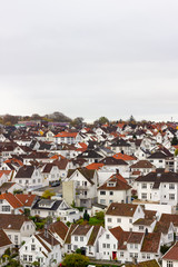 Fototapeta premium Thousands of white houses with red rooftops are the historic district in Stavanger called Gamle Stavanger (Old Stavanger), Norway