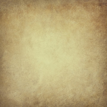 old brown parchment paper background with yellowed vintage grunge texture borders and light center with distressed faded antique colors