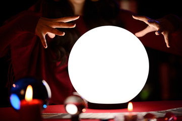 Fortune Teller's Hands are predicting on the crystal ball.