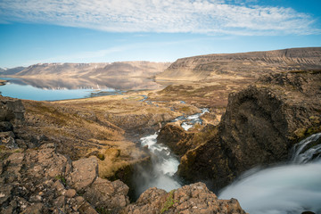 Dynjandi or Fjallfoss  big and powerfull waterfall cascade in the westfjords of the Icelandic wilderness during daytime. Waterfalls, traveling and iceland concept.