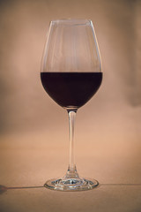 Glass of red wine on rustic backgroun