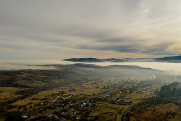 Image of beautiful village in the mountains, view of fog over little town, many houses in Lebanese...
