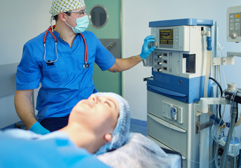 Man surgeon at work in operating room