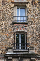 French house with traditional balconies and windows in Meudon. Municipality of Meudon (in the southwestern suburbs of Paris), Hauts-de-Seine, Ile-de-France, France.