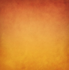 Yellow orange background with vintage texture, abstract solid elegant textured paper design in warm autumn colors