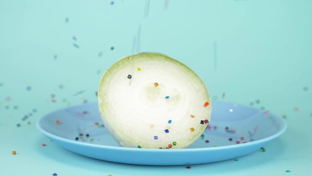  food design. half of the onion is sprinkled with confecti onery sugar sprinkles