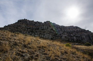 Bottom view of the cliffs, mountain landscape.