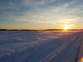 Cold snowy sun set