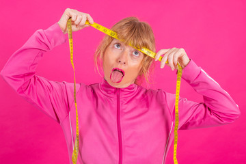 adult woman with desperate or stressed measuring tape, diet