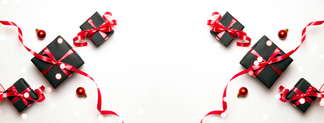 Xmas background. Red Christmas gifts, ornaments on white background top view. Winter holiday xmas present. Merry Christmas and Happy Holidays greeting card, frame, banner. New Year. Noel. Flat lay