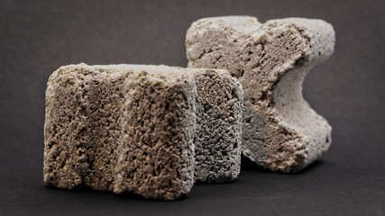 grey concrete spacers isolated on black background