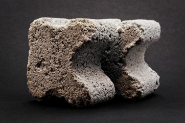 grey concrete spacers isolated on black background