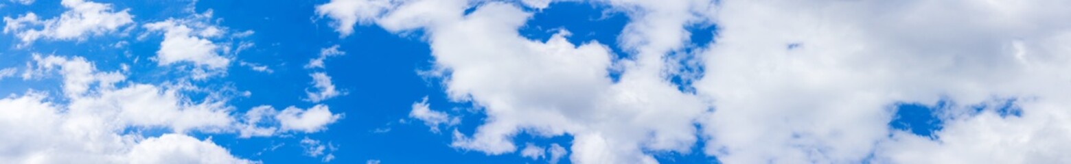 Naklejka na ściany i meble Panorama blue sky background with tiny clouds