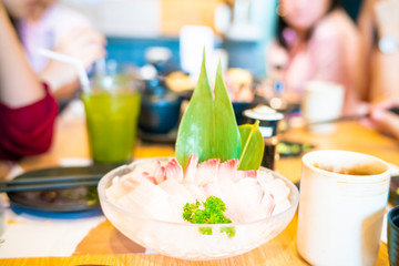 Obraz na płótnie Canvas Suzuki fish sashimi in bowl on ice with appetizer