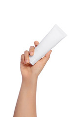 Beautiful Women hand holding white cosmetic tube isolated on white background