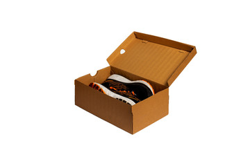 Running shoes in a brown box