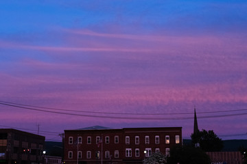 Purple sunset over small town