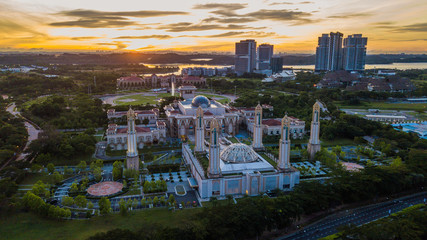 Fototapeta na wymiar Beautiful aerial landscape during sunrise at The Kota Iskandar Mosque located at Kota Iskandar, Iskandar Puteri, Johor State Malaysia early in the morning