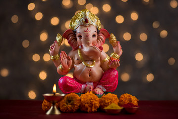 Hindu God Ganesha on Blured bokeh background, Ganesha Idol.