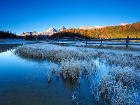Autumn reflections on the lake Lej da Staz, Engadine Saint Moritz, Switzerland
