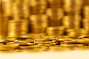 A group of golden coin shallow focus with fill in frame