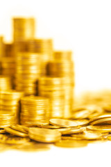 A portrait of golden coin stacking in vertical row and random set on ground