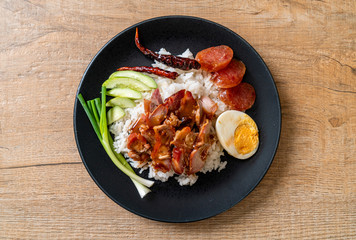 Barbecued red pork in sauce on topped rice
