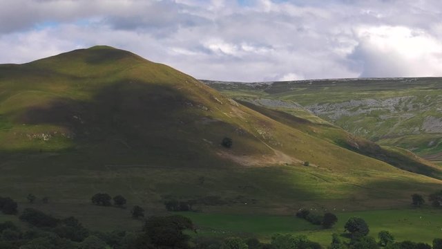 4K evening clouds moving over the Pennine hills including Dufton Pike, summer, daytime, Cumbria, UK