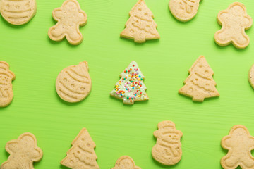 gingerbread cookies of different shapes on a green background
