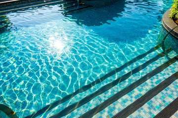 swimming pool in garden decoration in hotel resort