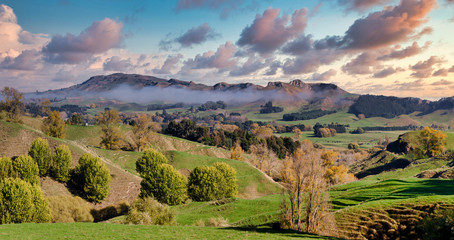 Colourful clouds over the rural farming landscape at Te Mata Peak ridge near  Tuki Tuki new zealand
