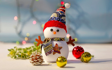 Christmas snowman and light background