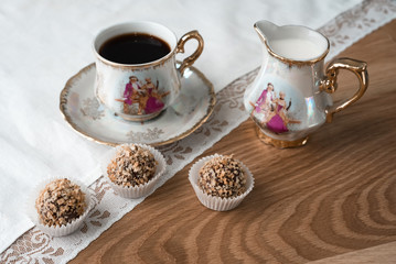 An excellent moment of relaxation over a Cup of coffee with cream and chocolates in waffle crumbs. 