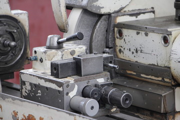 Close up tail block draw chuck of turning lathe grinder machine tool on spindle headstock background, industrial metal working