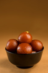 Gulab Jamun in bowl. Indian Dessert or Sweet Dish.