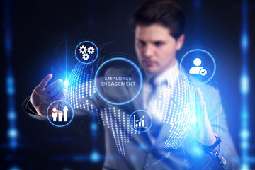 Planning marketing strategy. Business, Technology, Internet and network concept. Young businessman shows the word: Employee engagement