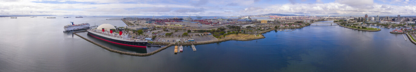 Fototapeta na wymiar Queen Mary, Port of Long Beach and Long Beach downtown modern skyline panorama aerial view in harbor of Long Beach, Los Angeles County, California CA, USA.