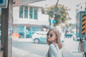 Fototapeta na wymiar Portrait of young beautiful asian woman wearing the sunglasses looked at the camera