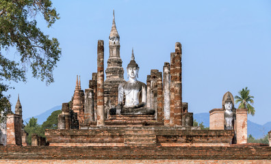 Fototapeta premium Ancient Buddha statue at sunrise in Ayutthaya, Thailand