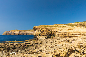 Fototapeta na wymiar Ruins of Azure Windows in Dwejra Bay in Malta with its dramatic coastal formations
